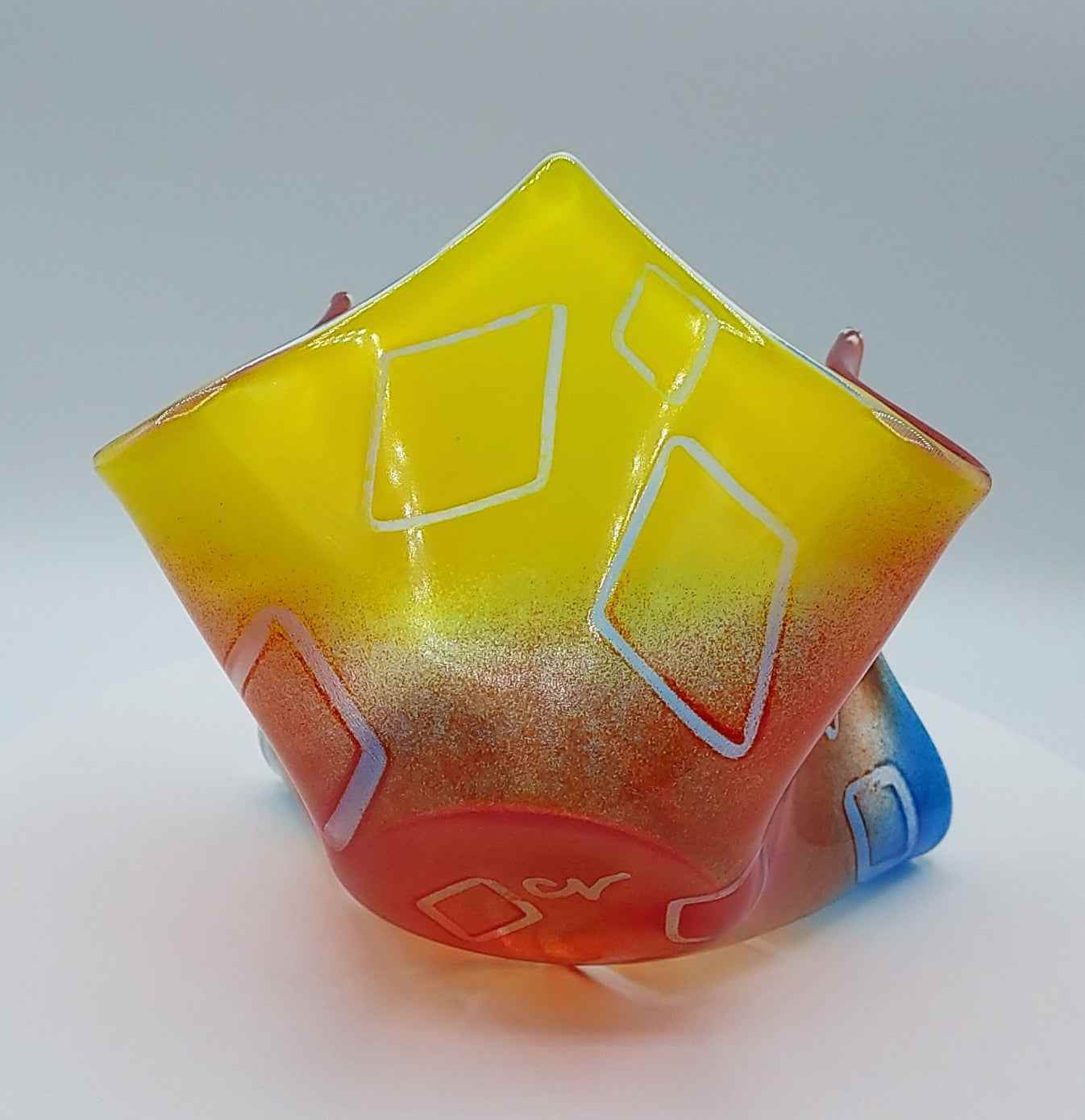 Primary colors glass vase with floating diamond pattern